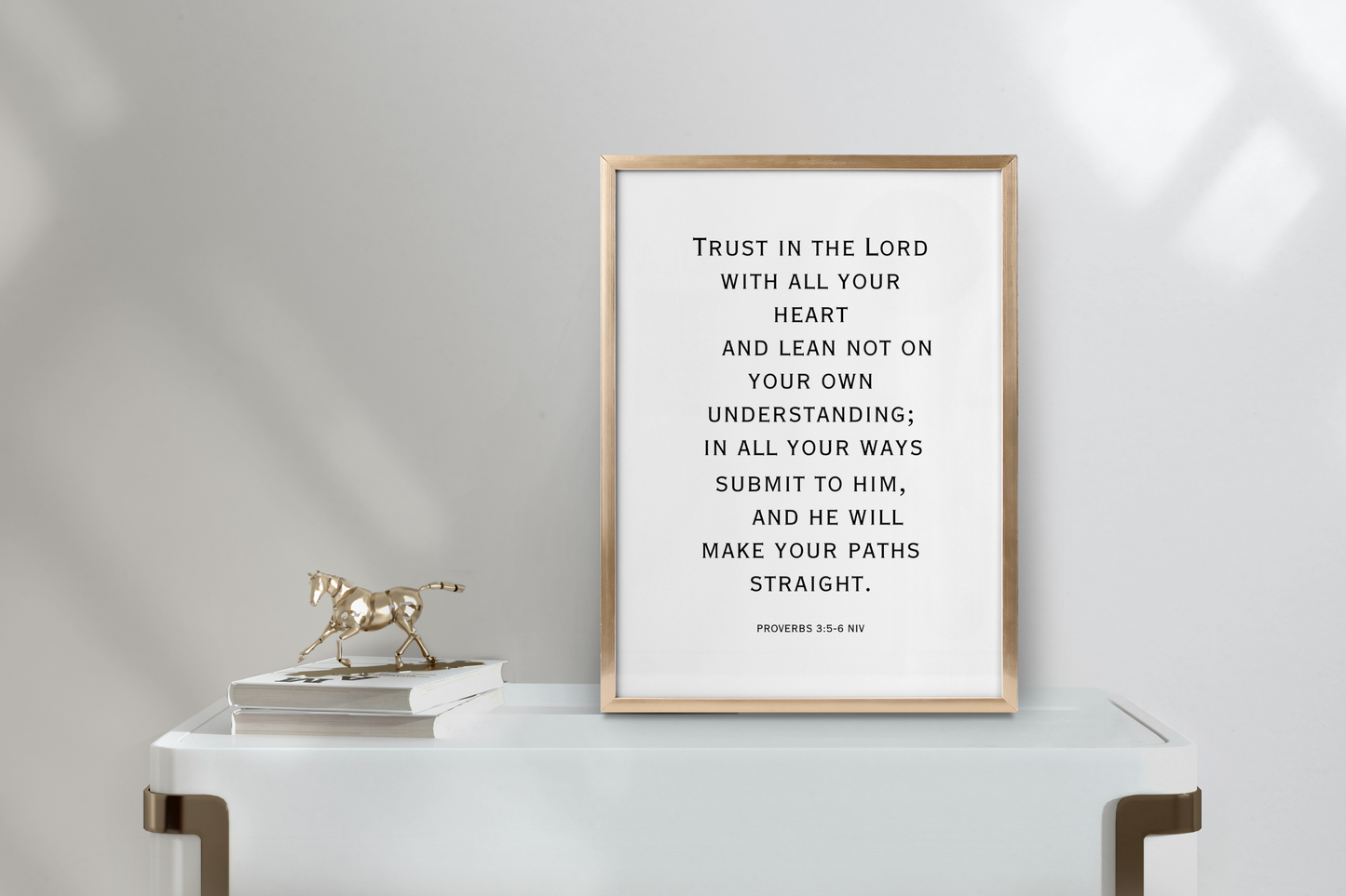Printable Proverbs 3:5 Bible verse wall art in modern typography framed in a clean, minimalist living room.