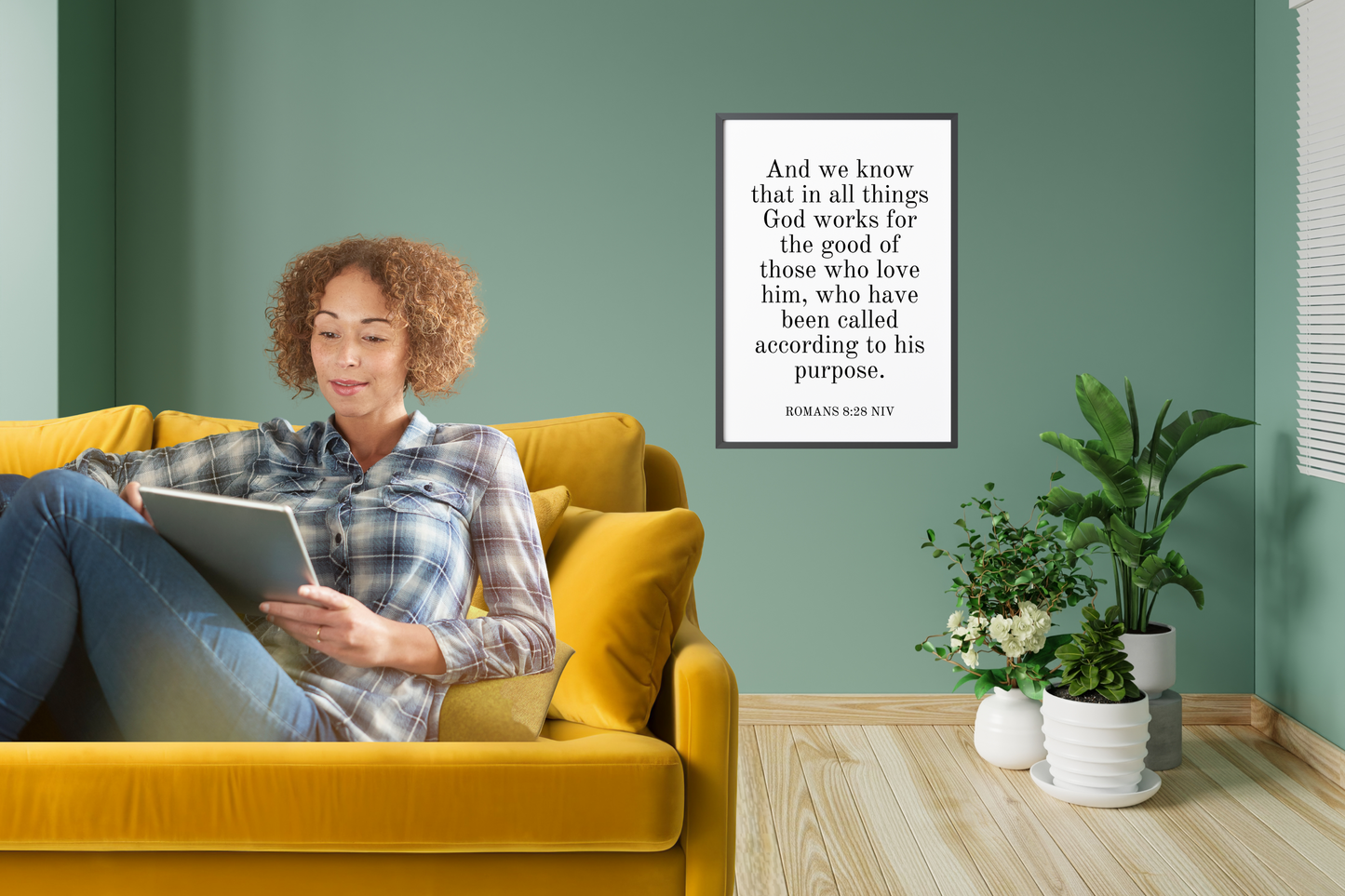 Clean and contemporary Romans 8:28 Christian wall art in a bright living room setting.