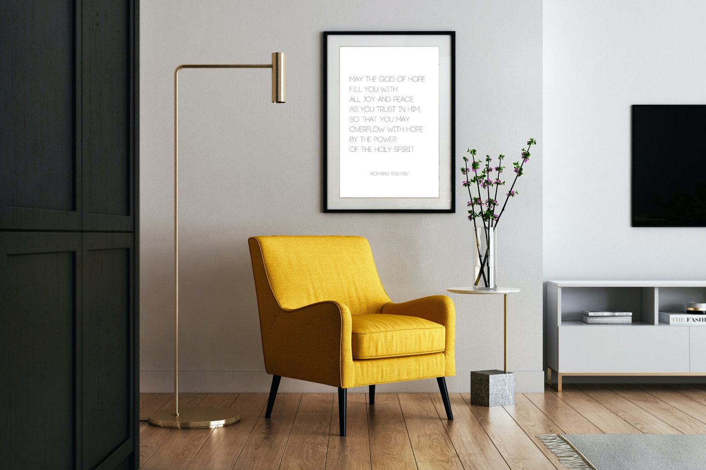 Romans 15:13 Christian typography wall art printable in minimalist black border frame displayed in a modern living room