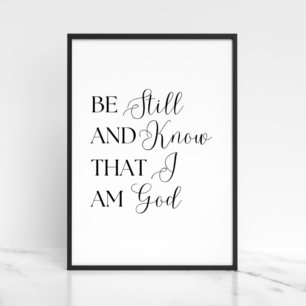 Framed print with 'Be Still And Know That I Am God' text on a white background