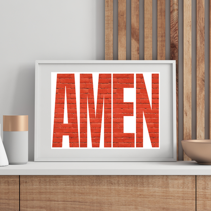Amen poster in a white frame displayed in a modern boho room
