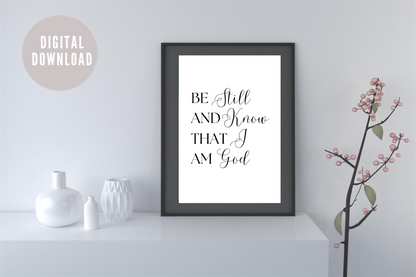 Black and white typography Bible verse artwork displayed in a narrow hallway above a console table, styled with decorative vases and a hall plant