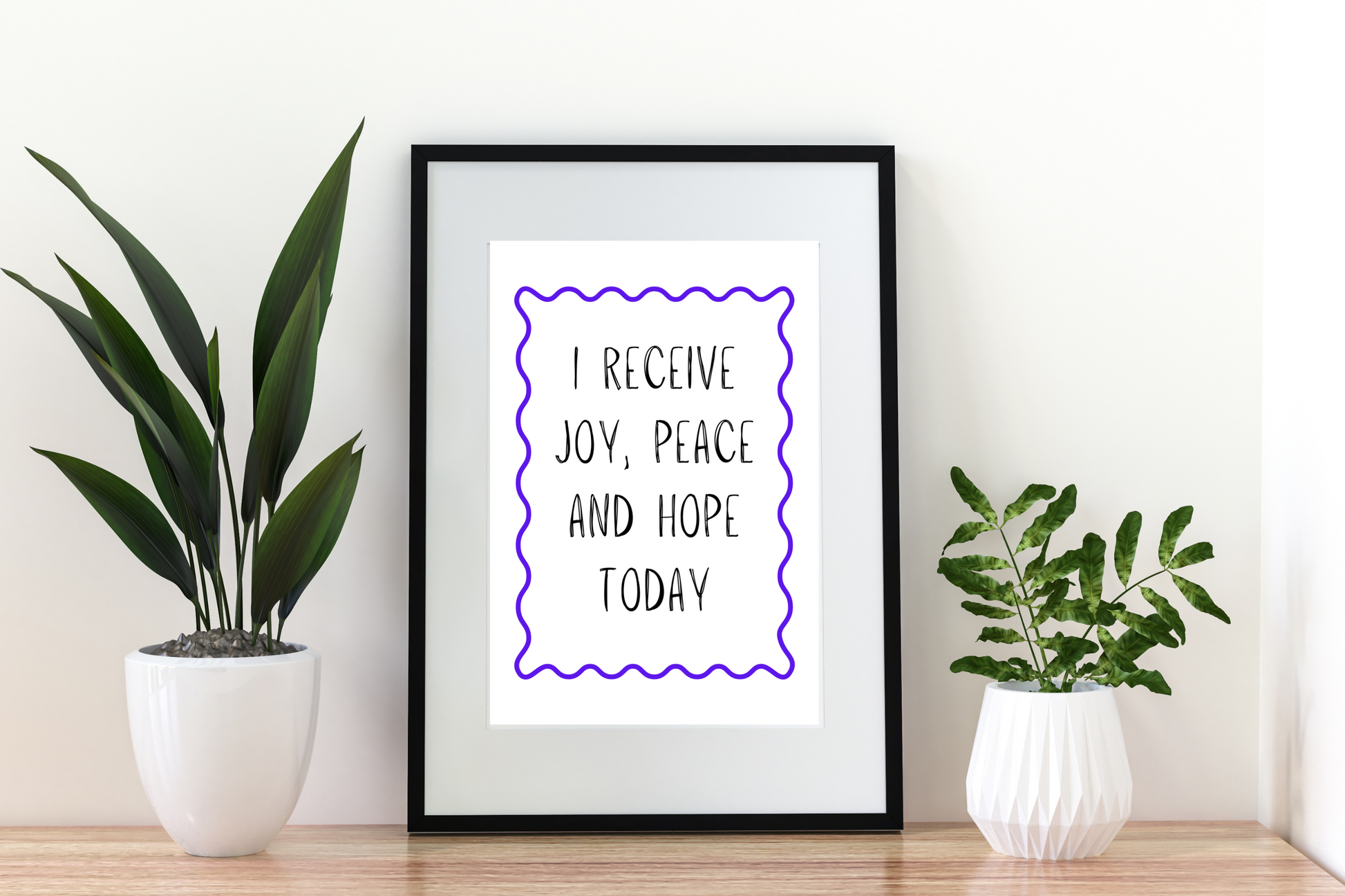 4x6 printable wall art with the affirmation “I receive joy, peace and hope today” styled in a minimalist modern living room