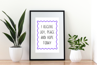 4x6 printable wall art with the affirmation “I receive joy, peace and hope today” styled in a minimalist modern living room