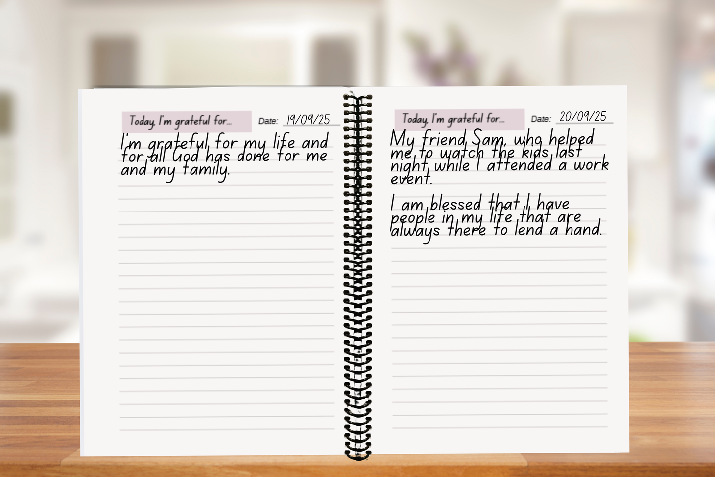Faith-based Daily Gratitude Journal open on a a wooden table — A4 coiled-bound journal for mindfulness and thankfulness.