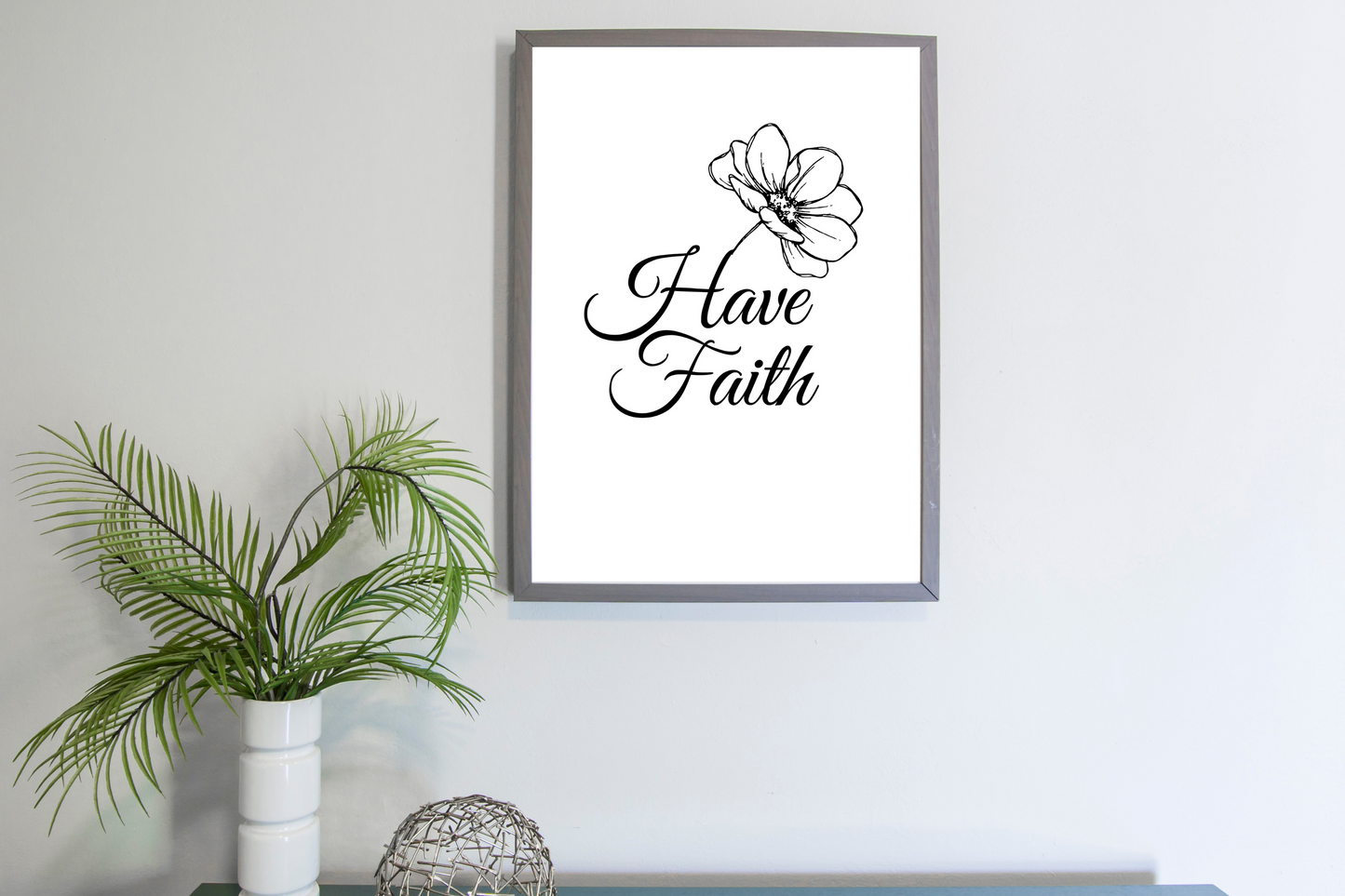 Black and white Have Faith wall art styled in a modern home office with simple, minimalist décor