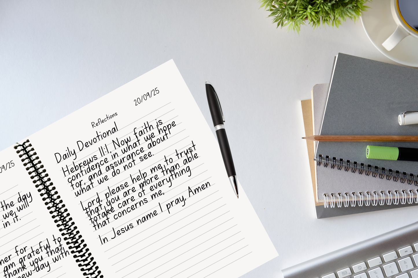 RIP While Alive Scripture Reflection Journal on office desk beside other notebooks — 150-page coiled Christian journal for Bible study and prayer.