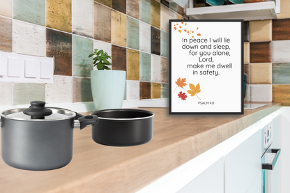Modern typography Bible verse print displayed in a bright kitchen corner with rustic tiles.