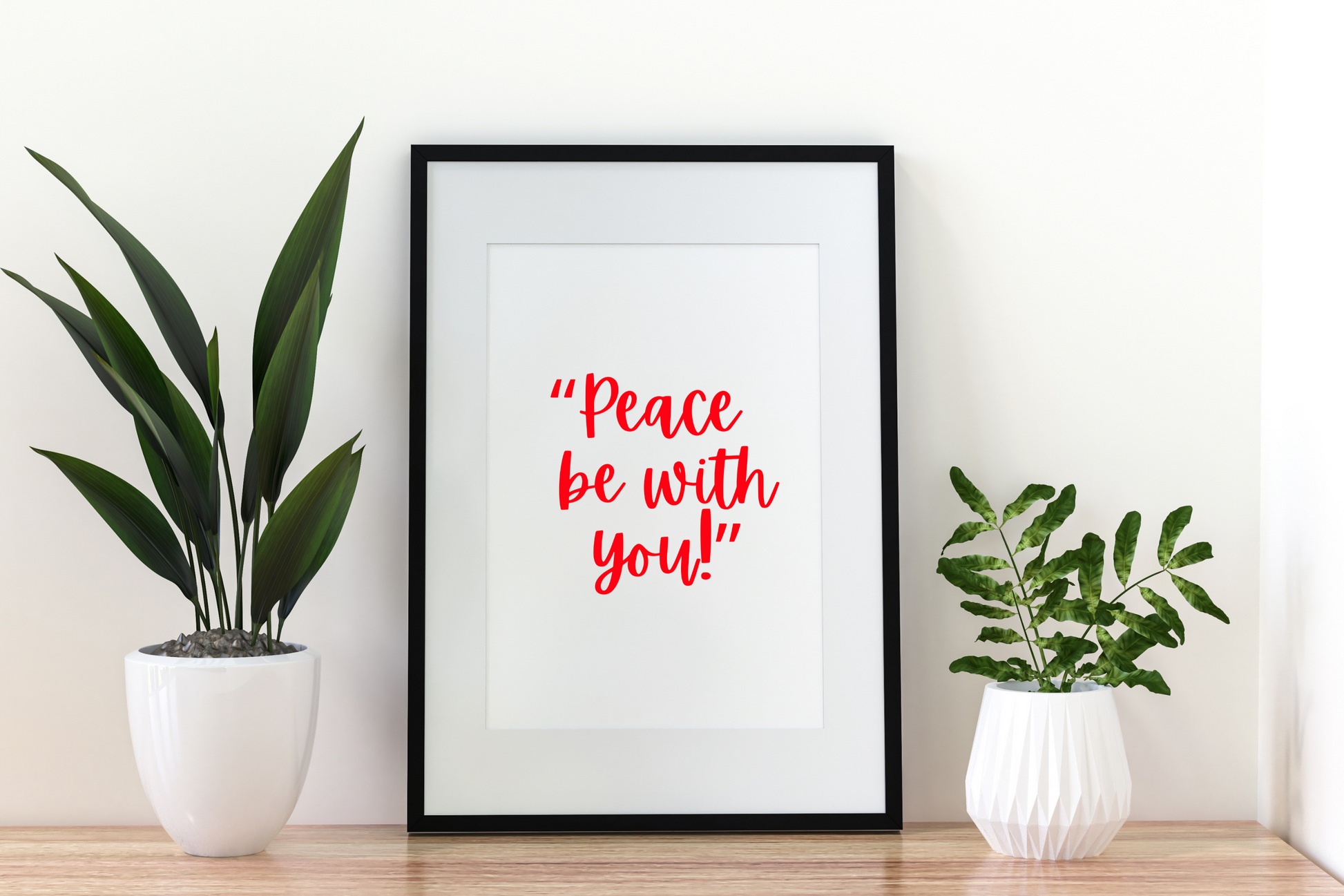 Inspirational Christian digital art print with the caption Peace Be With You styled above a home shelf.