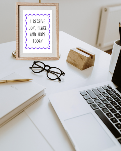 Motivational printable wall art with bible verse inspired typography framed in a modern home office.