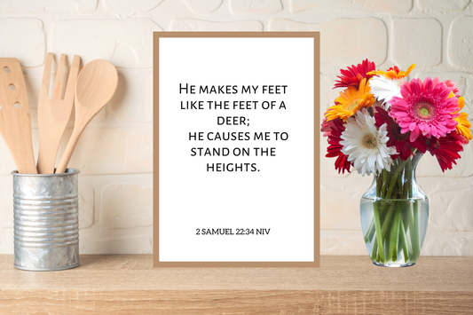 Faith-based printable wall art featuring “He makes my feet like the feet of a deer” displayed in a bright kitchen.