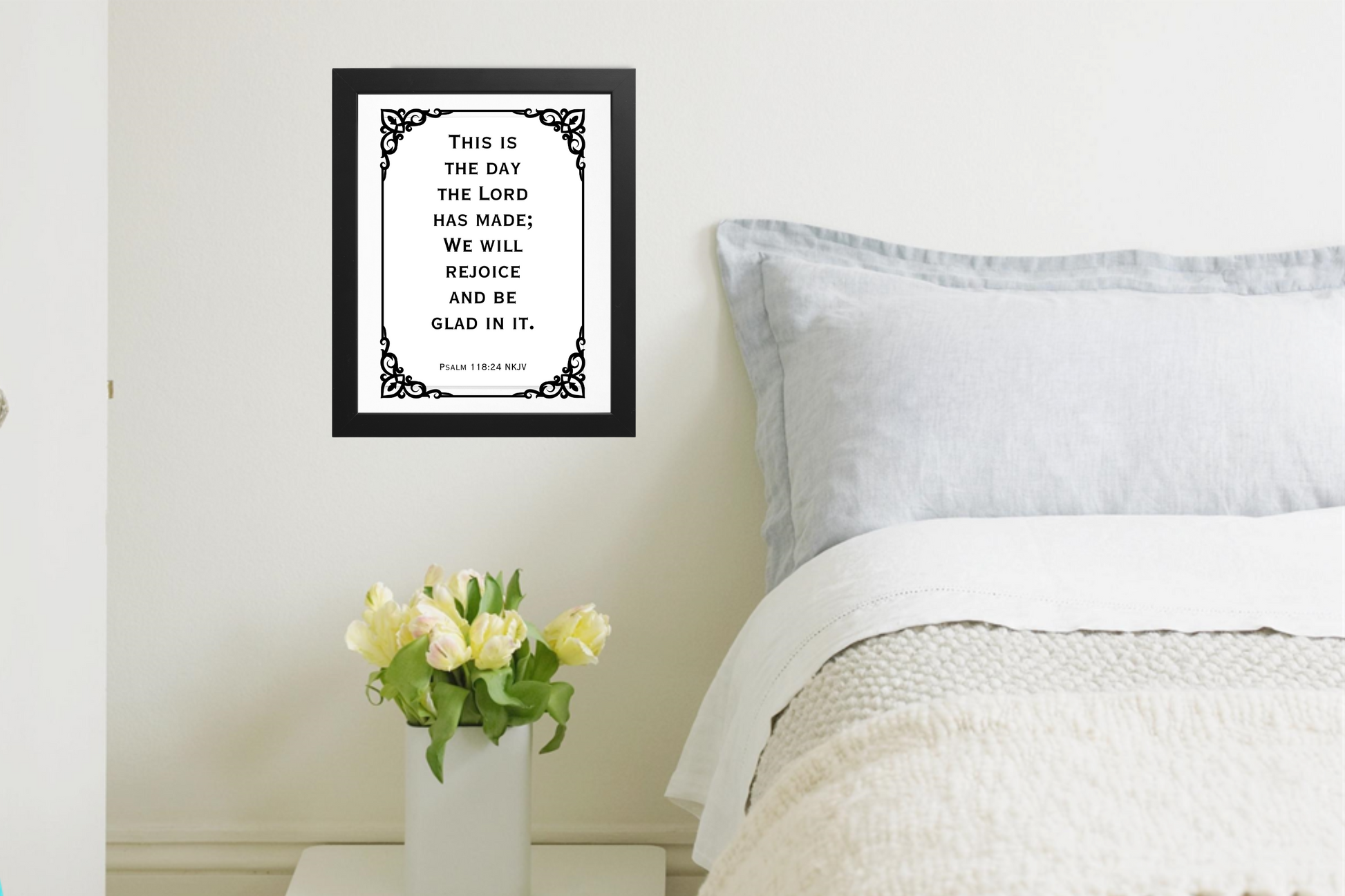 Contemporary printable wall art featuring Psalm 118:24 verse in bold black typography on a white background in a neutral bedroom