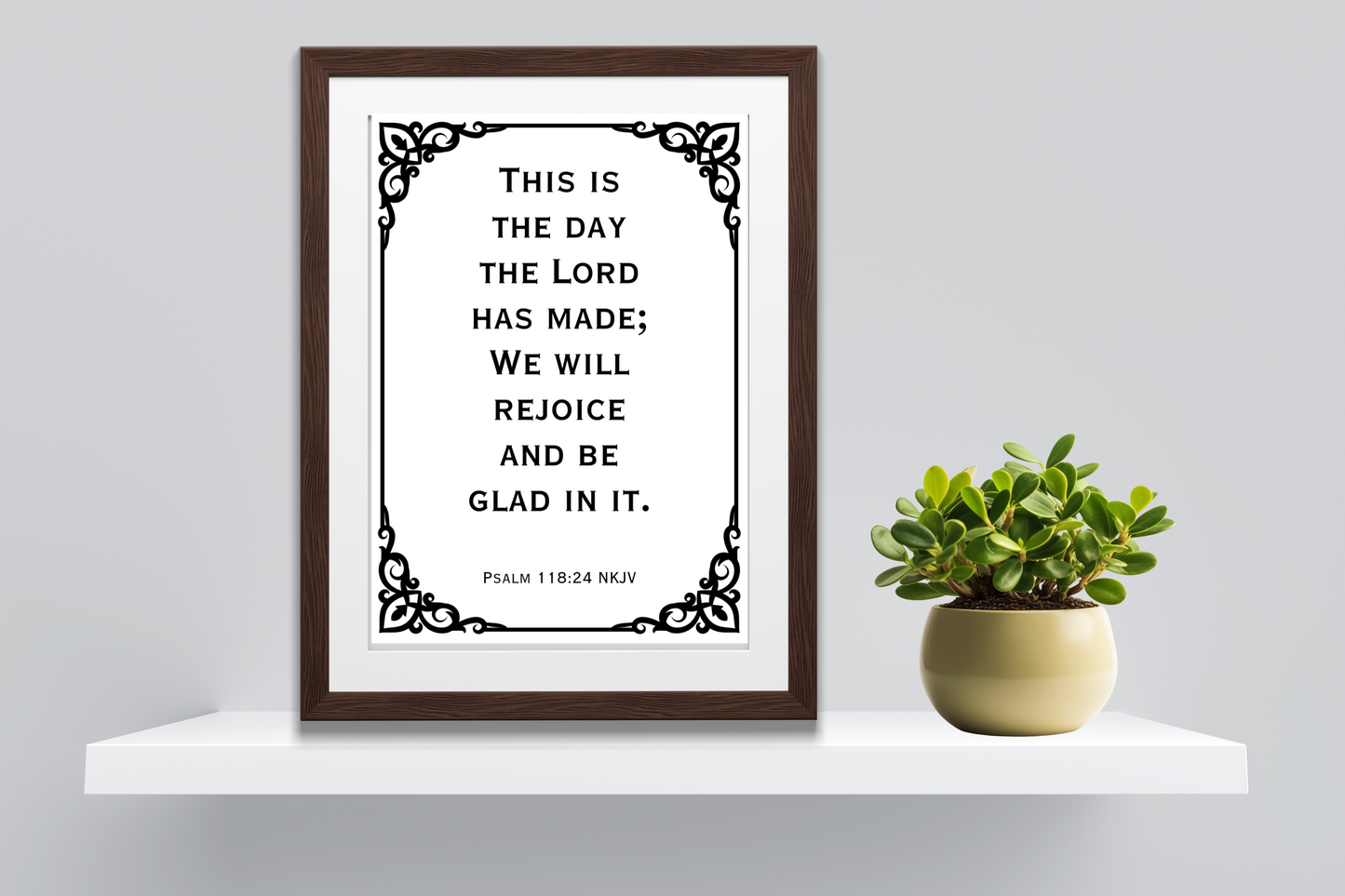Inspirational scripture digital art print of Psalm 118:24 styled on a minimalist home shelf with clean decor and a plant.
