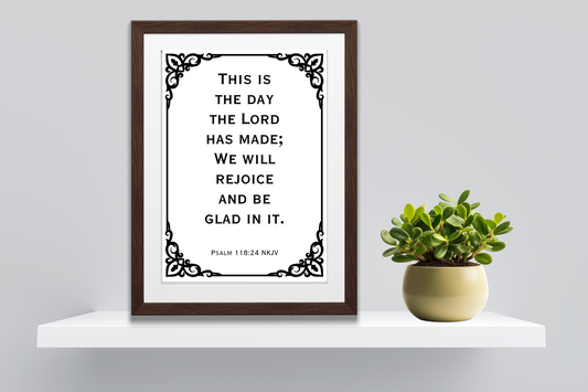 Inspirational scripture digital art print of Psalm 118:24 styled on a minimalist home shelf with clean decor and a plant.